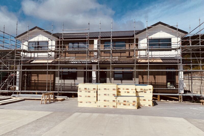 Colour image of Hutt Valley townhouses under construction with scaffolding