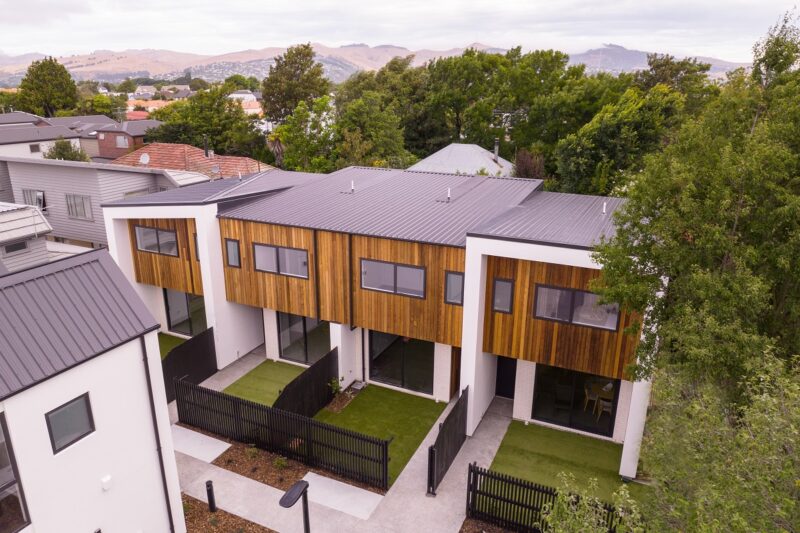 Aerial image of townhouses in Christchurch with Port Hills in the background