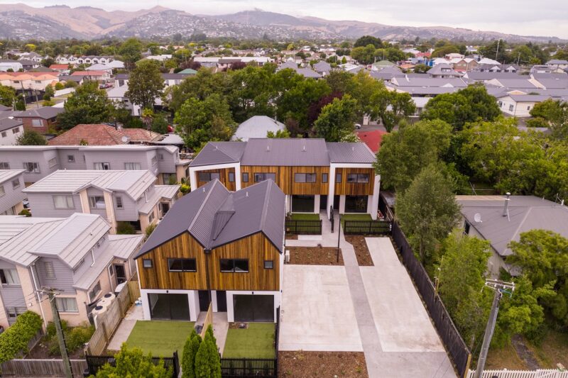 Aerial image of townhouses in Christchurch with Port Hills in the background